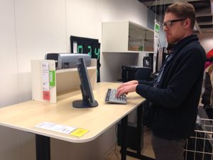 My son at the standing desk in the IKEA store