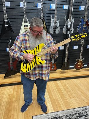 David playing a sweet guitar in the Sweetwater store